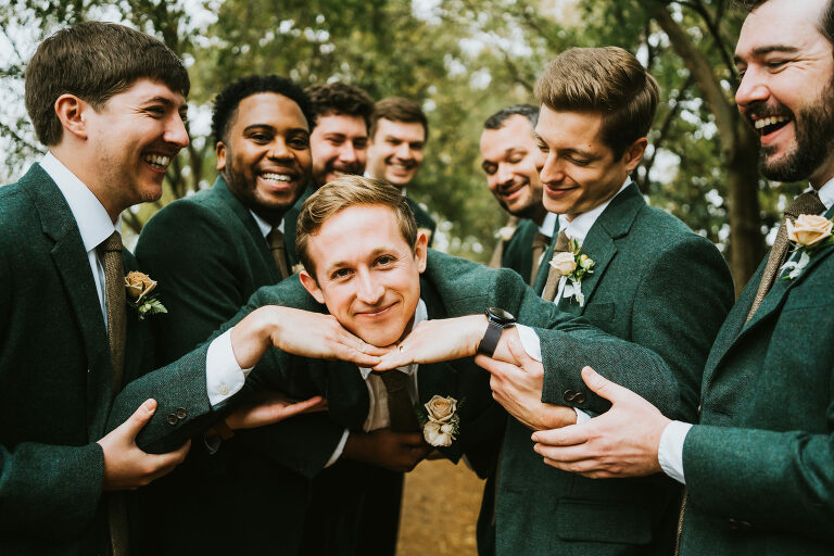 groom being silly with his groomsmen