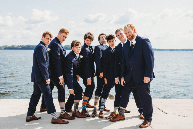 groomsmen show off their matching socks