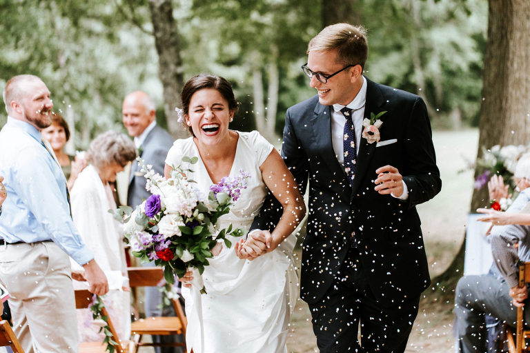 bride and groom exit their wedding ceremony